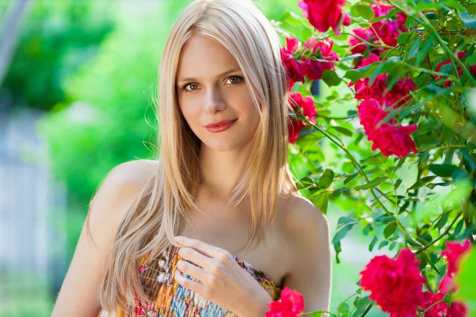 beautiful portrait blonde woman in nature background