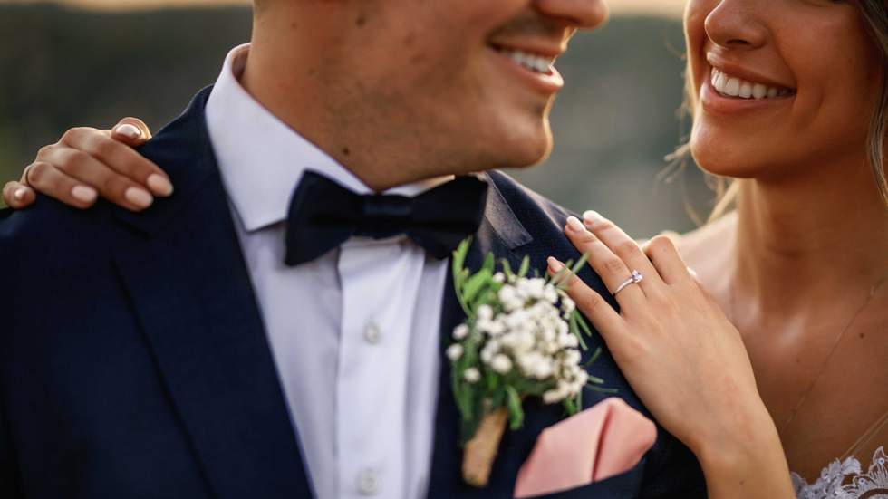 bride and groom smiling close up