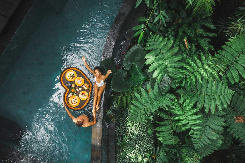couple in a jungle swimming pool