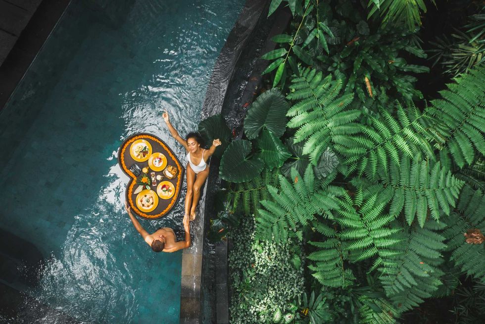 couple in a jungle swimming pool