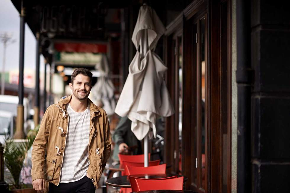 Cropped shot of a fashionable young man strolling through the city.