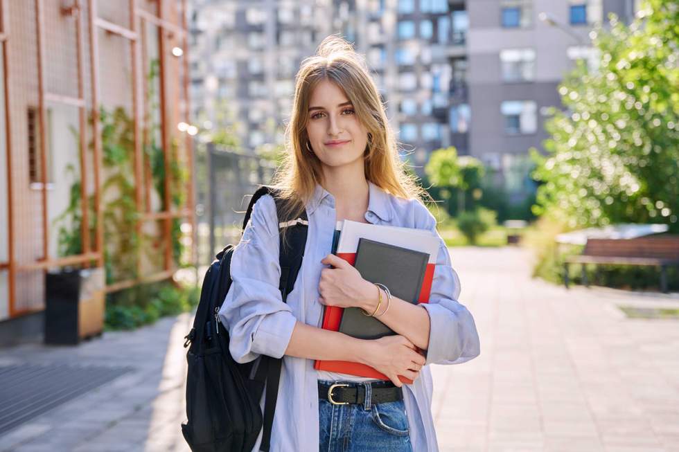 girl holding school books