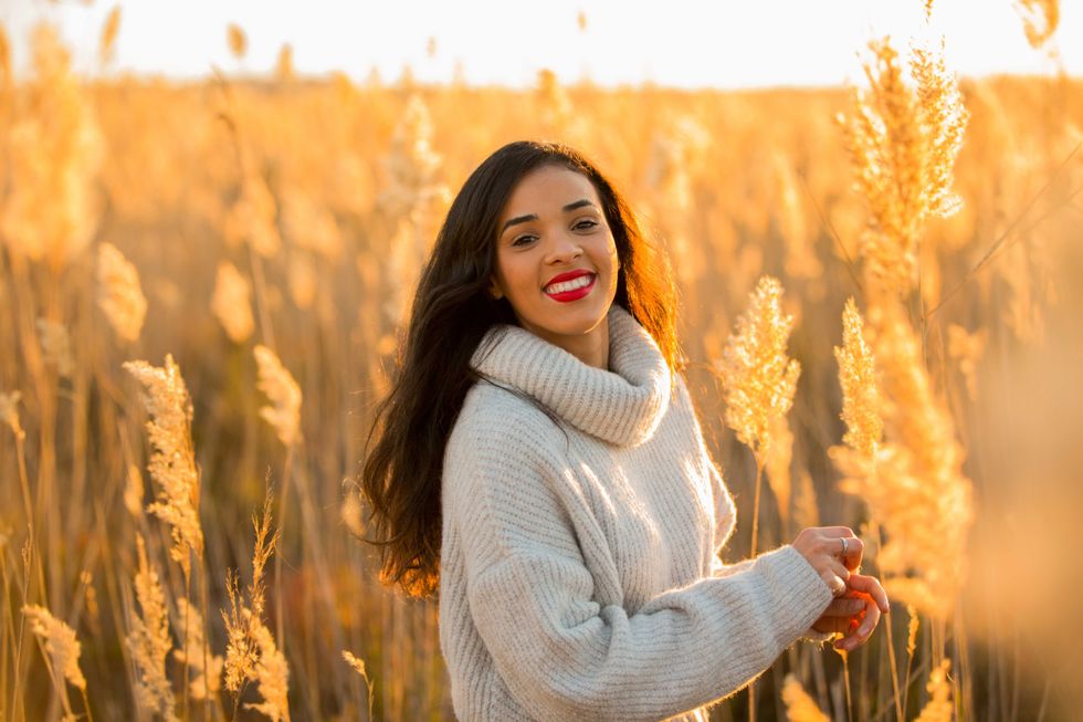 happy woman posing on the nice sunset countryside