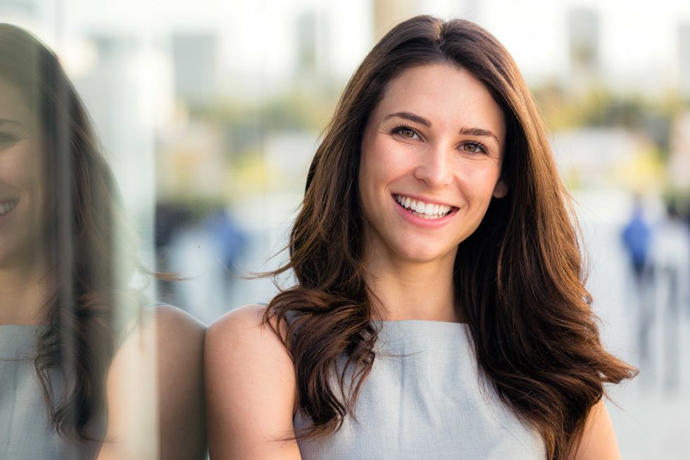 Naturally beautiful woman with perfect white teeth smile, genuine, positive, happy, smiling