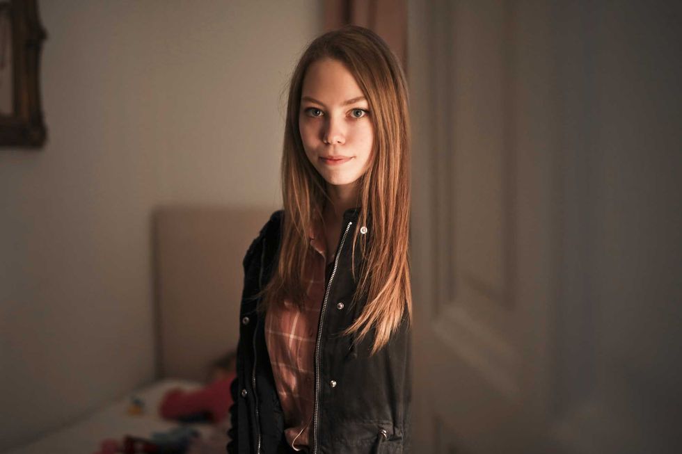 portrait of a young girl in a room at home