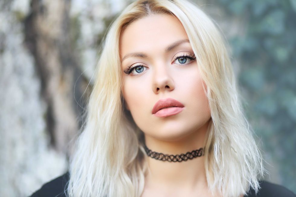 portrait of beautiful blond woman outdoor face close up