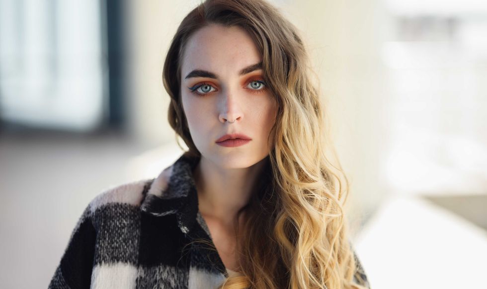 Portrait of young beautiful woman. Natural light. Shallow depth of field.