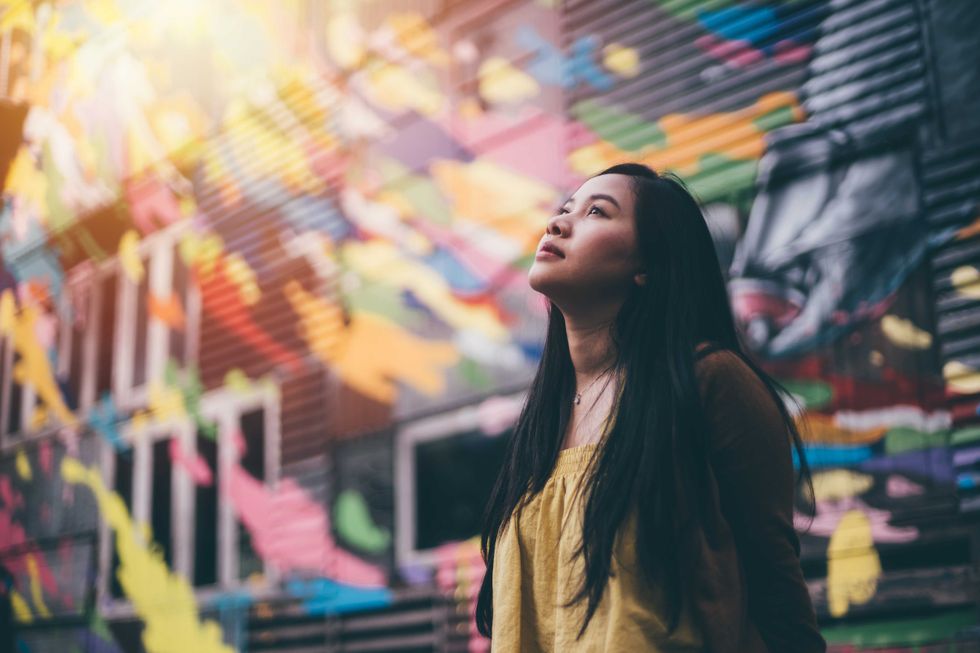 Portrait of young pretty hipster asian woman
