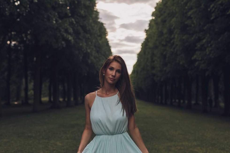 pretty woman standing in a park