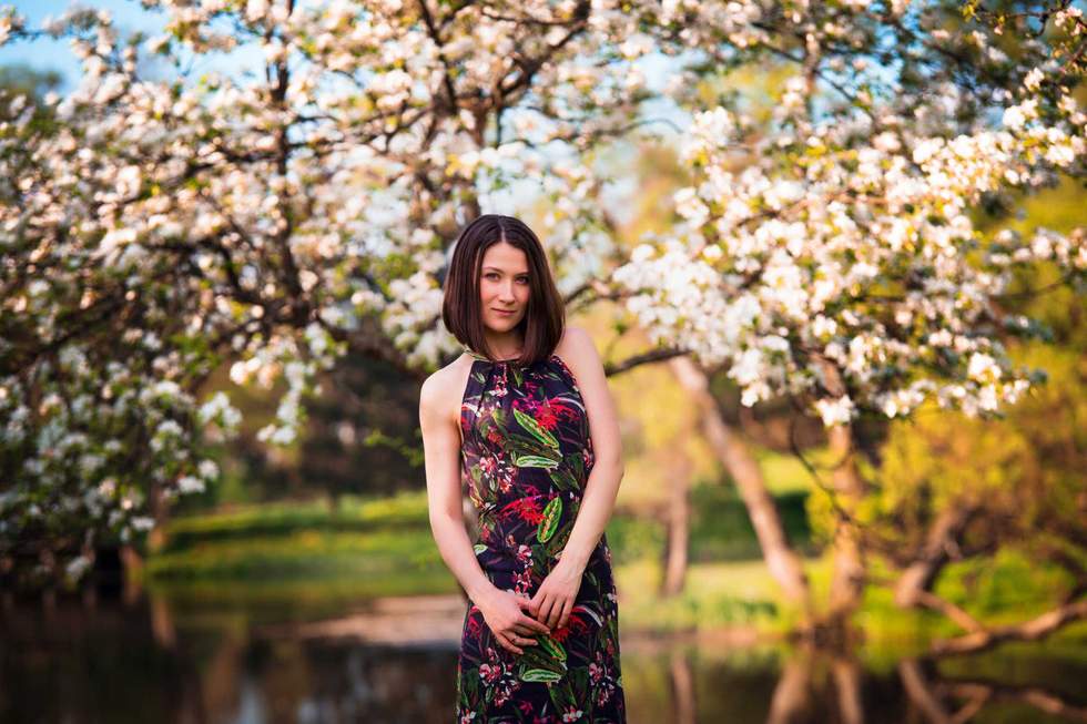 Serious woman portrait with beautiful dark hairs outside