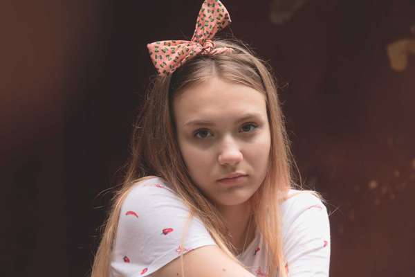 teen girl with serious expression