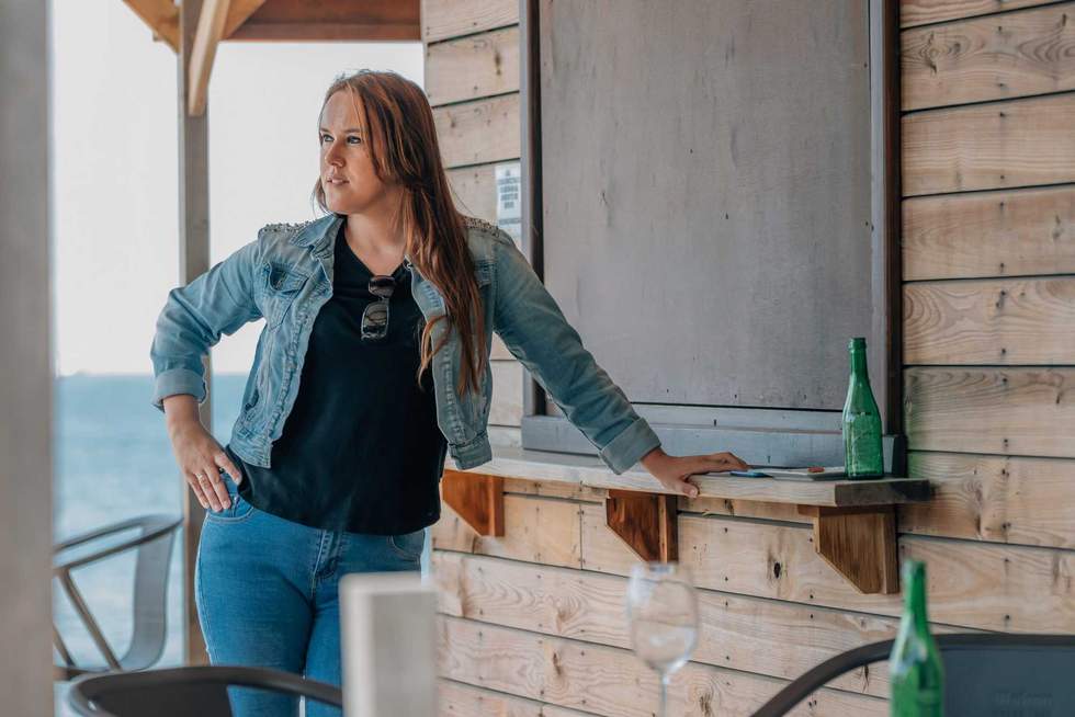woman at the beach bar in summer