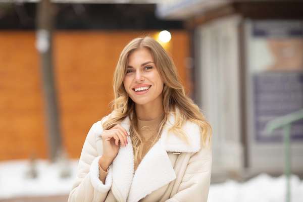 woman in a white coat