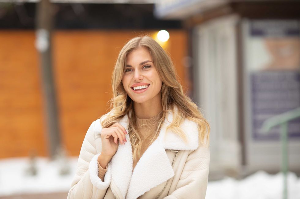 woman in a white coat