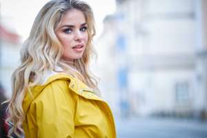 woman in a yellow coat
