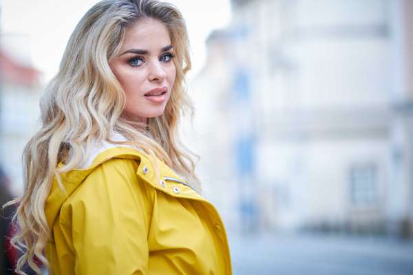 woman in a yellow coat