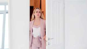 Woman opening door. tired woman enters a room or her apartment after a hard day at work