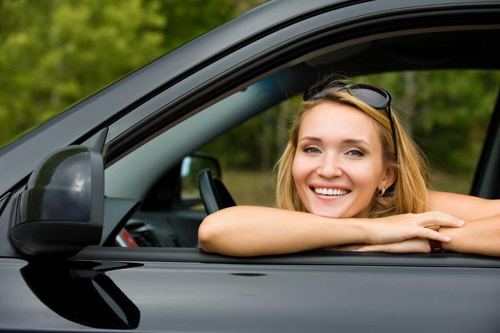 woman smiling in the car