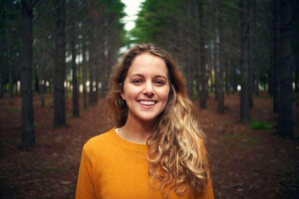 woman standing in the forest