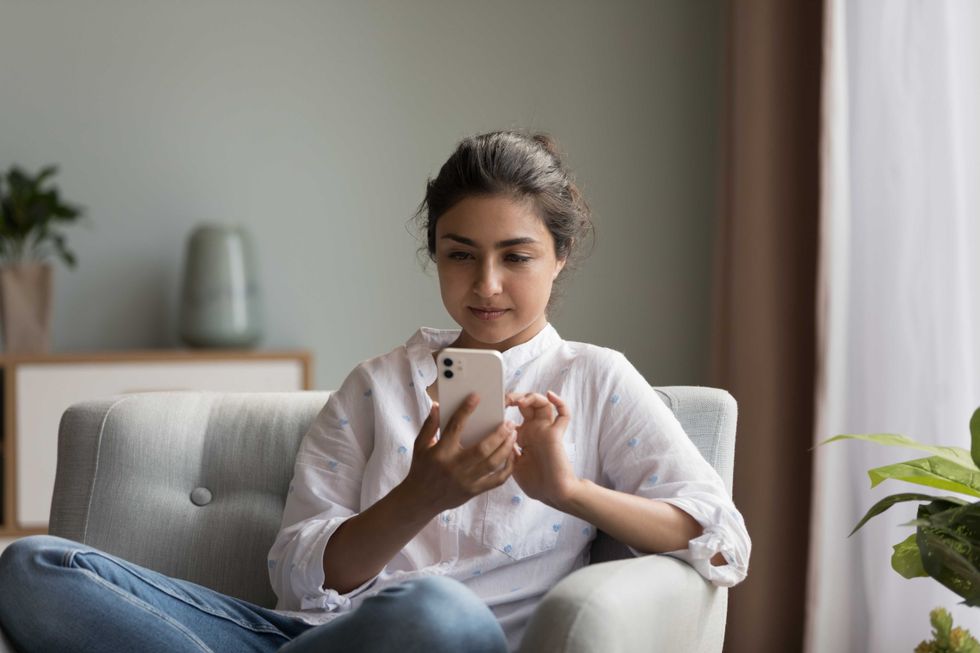 women relaxing on phone