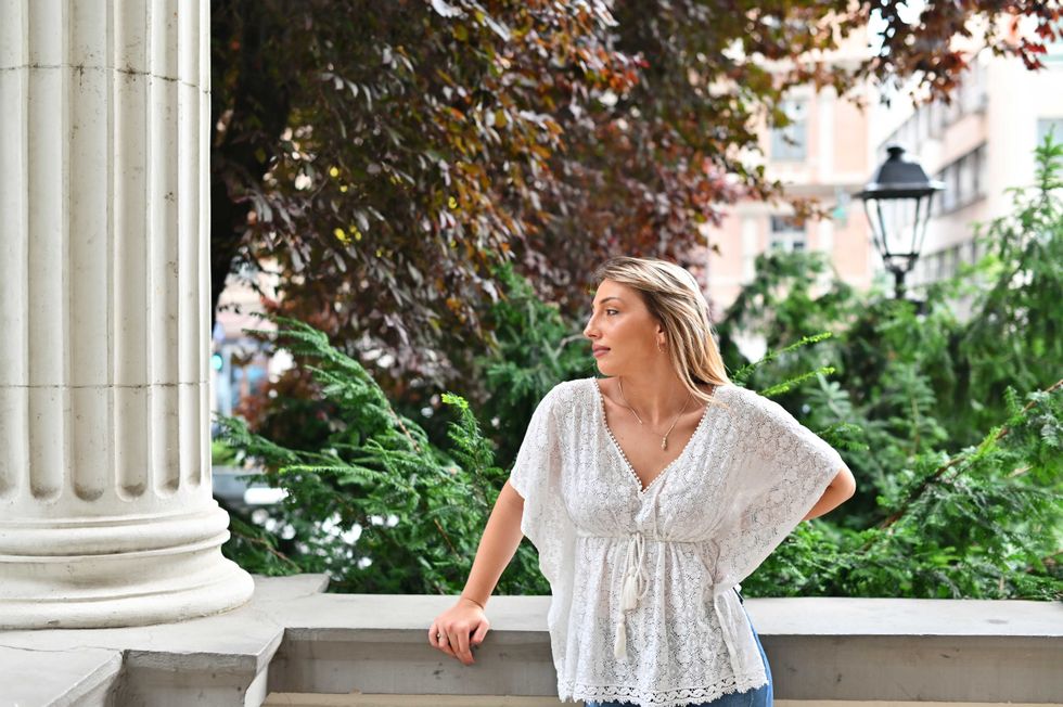 young beautiful woman standing outdoors