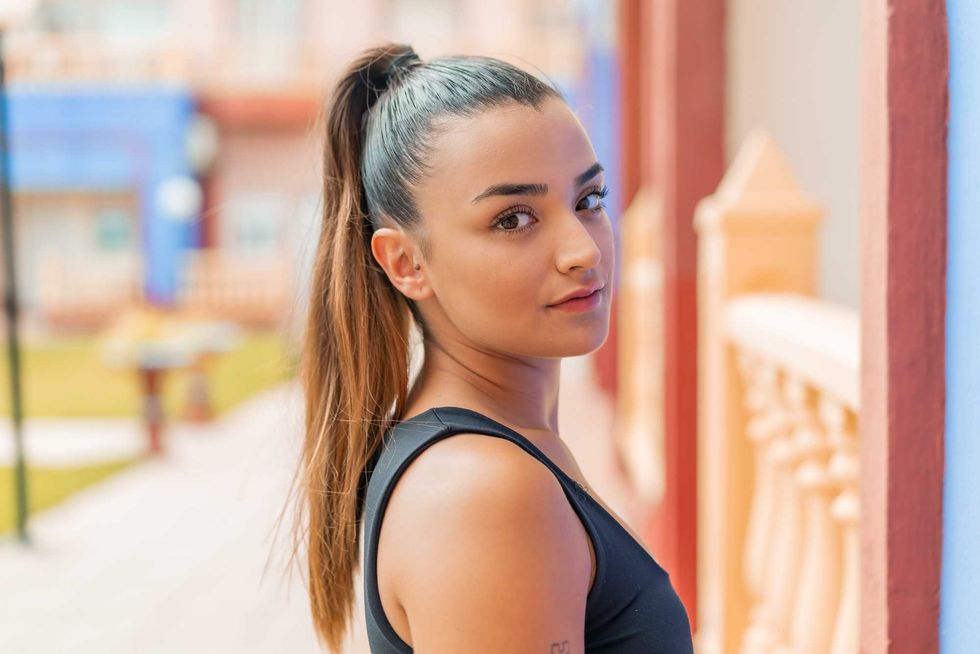 Young pretty woman at outdoors . Portrait