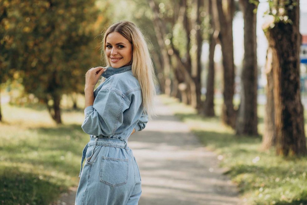 Young woman in denim jumpsuit