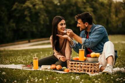 Two people bonding over snacks and beverages
