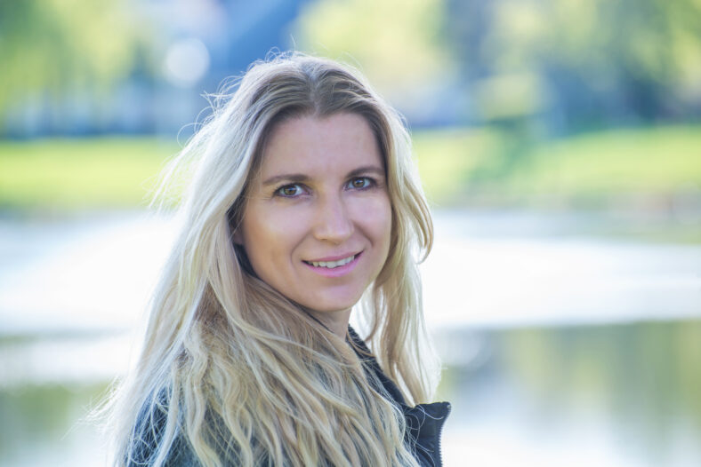 Portrait of a blonde woman in a park
