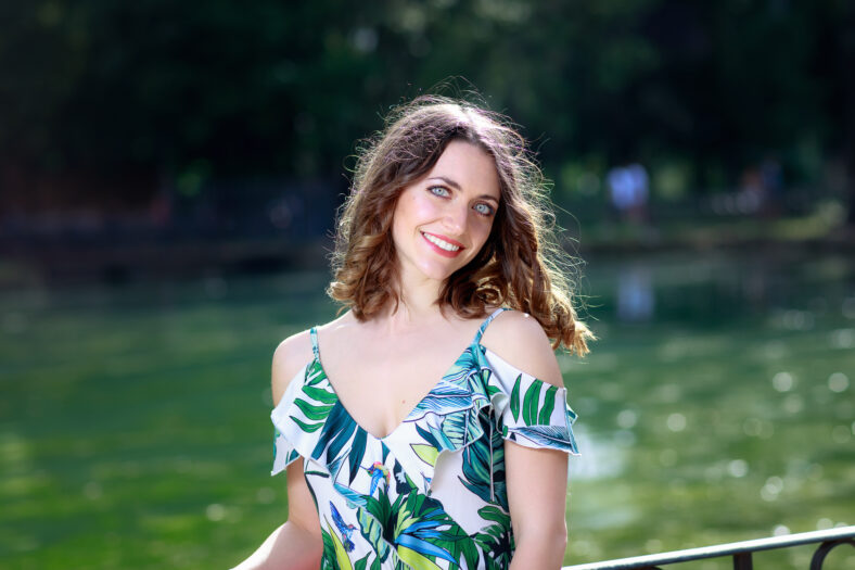 A beautiful European girl, of fair complexion, brown hair, blue eyes.