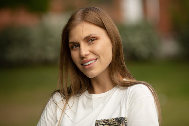Young woman smiling at the park.