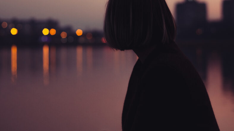 portrait of a young woman portrait with the short blond hair beautiful girl night lights lake river