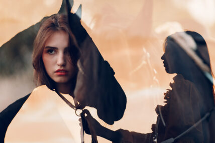 Woman silhouette with her horse at outdoors