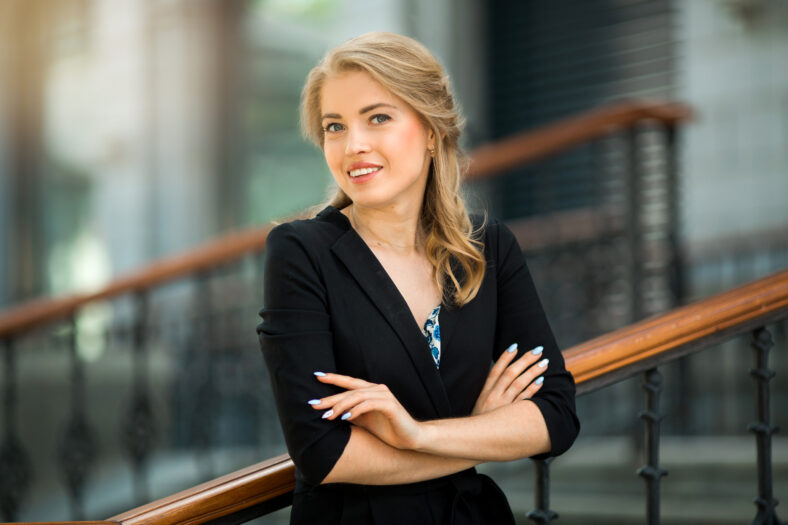 portrait of a beautiful young woman in a black suit
