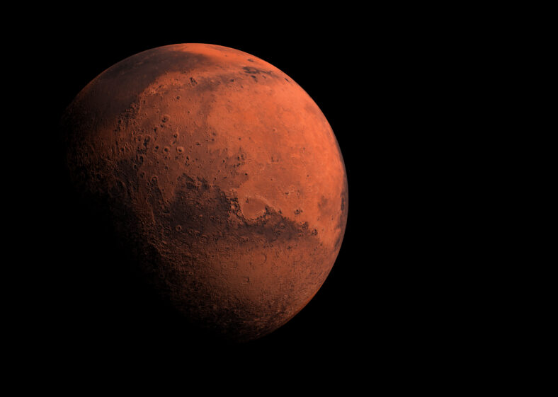 Mars red planet orbiting in space with heavy shadow across the world concept