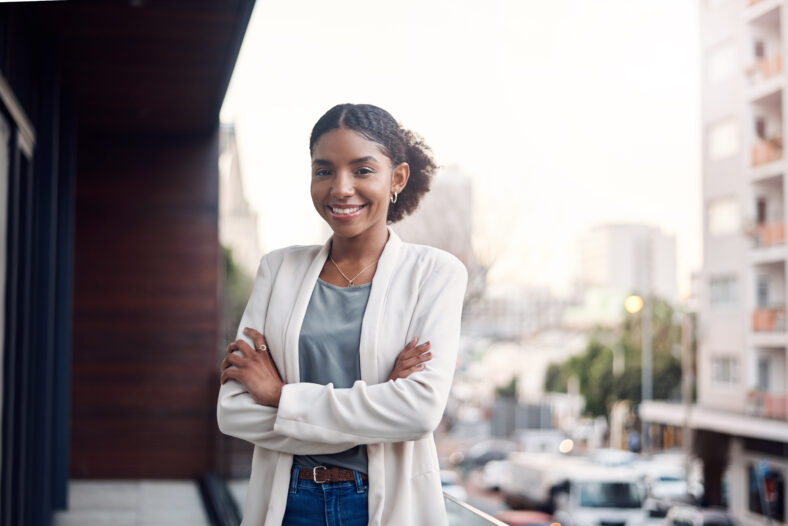 Crossed arms, city and portrait of business black woman with confidence, company pride and startup ideas. Professional, office and person in workplace for career, job and work opportunity on balcony.