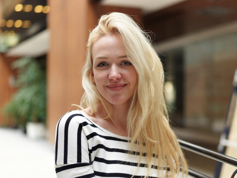 happy young blonde business woman portrait at office