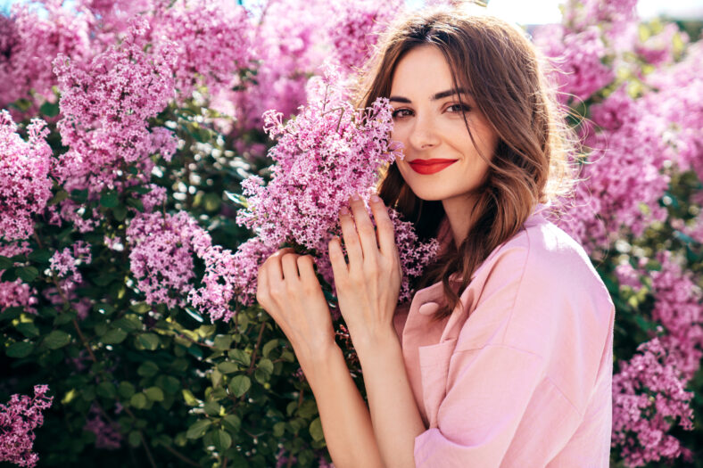 Young beautiful smiling woman in trendy summer clothes.
