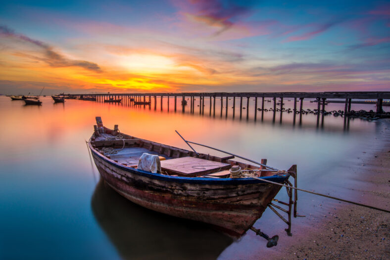 sunset on the sea with a boat