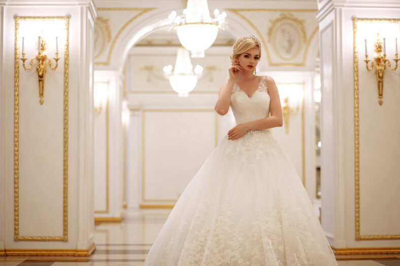 beautiful young woman bride in luxury wedding dress in interior