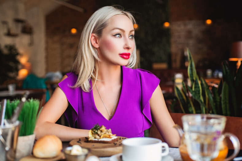 Attractive Woman dinning in Restaurant
