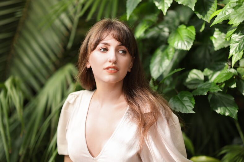 Portrait of beautiful woman in tropical forest