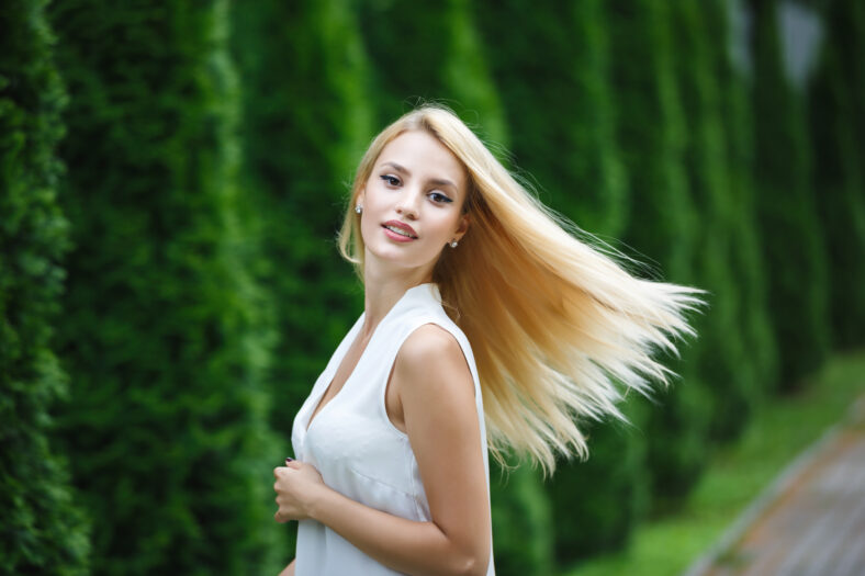 Portrait of adorable blonde woman outdoor, summer time