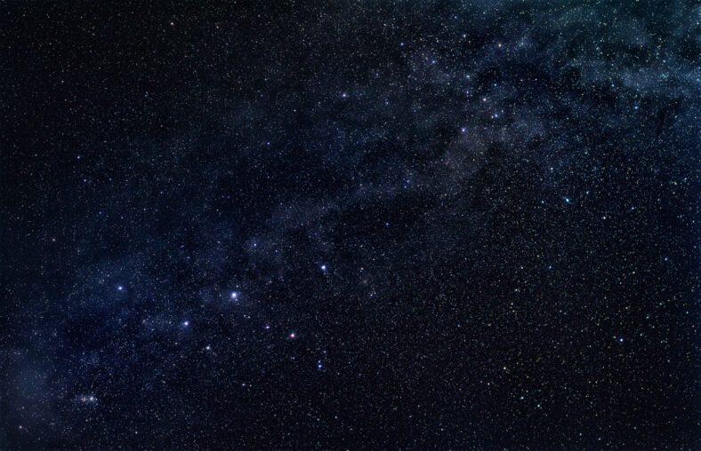 Constellation Cassiopeia with stellar band of our galaxy, the Milky Way, in the dark starry sky
