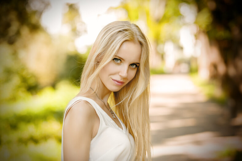 beautiful blond woman looking at camera outdoor