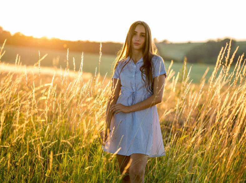 Girl with backlit hair at dusk