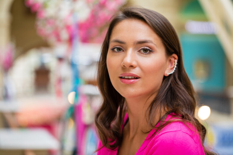 Young beautiful brunette woman in the mall
