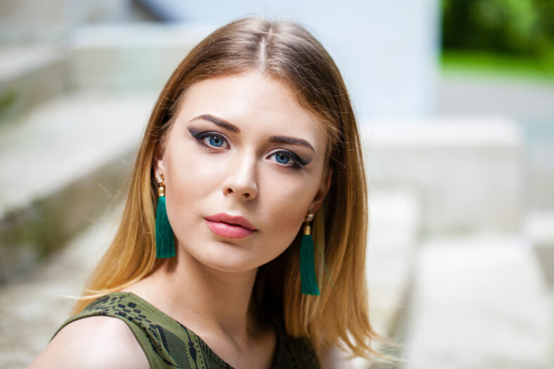 Portrait close up of young beautiful blonde woman, summer outdoors