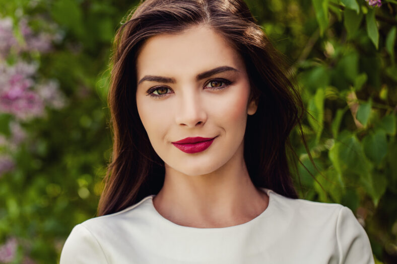 Beautiful Woman Face Closeup. Brunette Woman Outdoors Summer Portrait