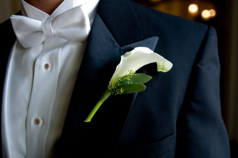 close up of groom's boutonniere